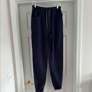 Jaanuu men’s navy blue jogger scrub pant. Size medium tall.